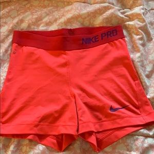 Orangey looking Nike pros